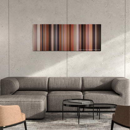 Volver color palette canvas on a concrete wall above a gray sectional sofa