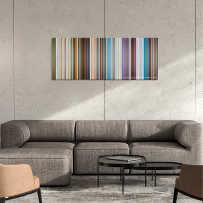 Balto color palette canvas on a concrete wall above a gray sectional sofa