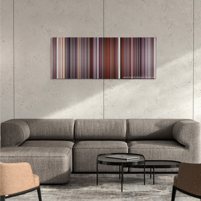 Along Came Polly color palette canvas on a concrete wall above a gray sectional sofa