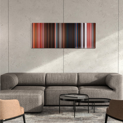 The Grand Budapest Hotel color palette canvas on a concrete wall above a gray sectional sofa