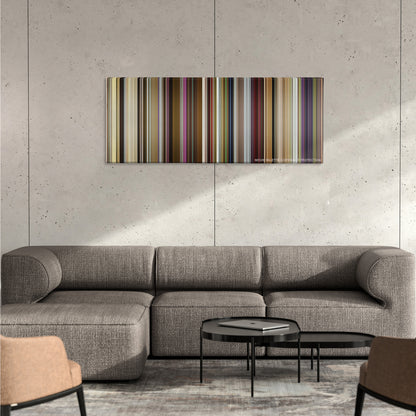 Yesterday color palette canvas on a concrete wall above a gray sectional sofa