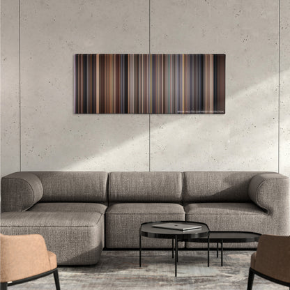 Rosemary's Baby color palette canvas on a concrete wall above a gray sectional sofa