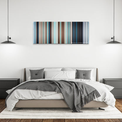 Free Willy color palette canvas above a bed, between two black pendant lamps