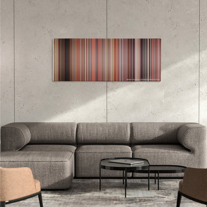 Billy Madison color palette canvas on a concrete wall above a gray sectional sofa
