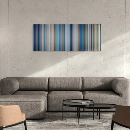 Bad Boys II color palette canvas on a concrete wall above a gray sectional sofa