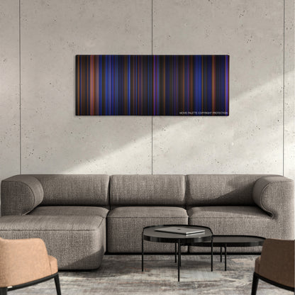 Hamilton color palette canvas on a concrete wall above a gray sectional sofa
