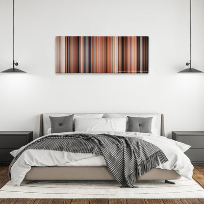 Volver color palette canvas above a bed, between two black pendant lamps