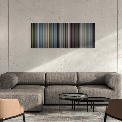 Billy Elliot color palette canvas on a concrete wall above a gray sectional sofa