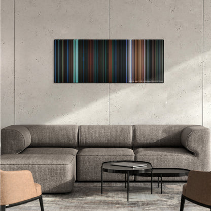 Escape from New York color palette canvas on a concrete wall above a gray sectional sofa