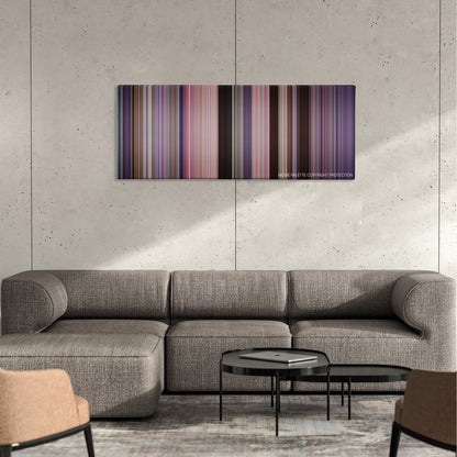 The Replacements color palette canvas on a concrete wall above a gray sectional sofa