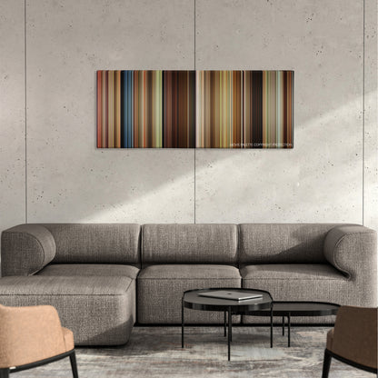 A River Runs Through It color palette canvas on a concrete wall above a gray sectional sofa