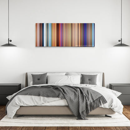 The Road to El Dorado color palette canvas above a bed, between two black pendant lamps