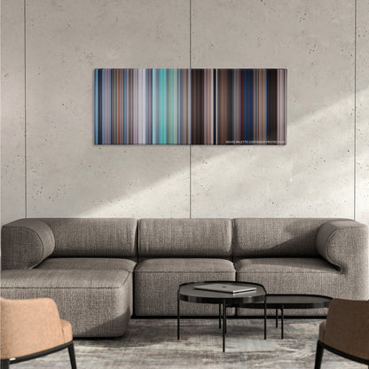 Mary Poppins color palette canvas on a concrete wall above a gray sectional sofa