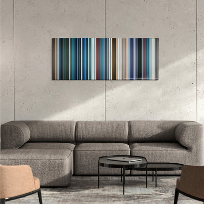 Aquaman color palette canvas on a concrete wall above a gray sectional sofa