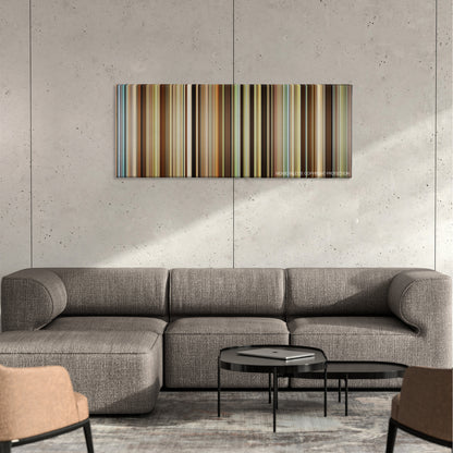 Out of Africa color palette canvas on a concrete wall above a gray sectional sofa