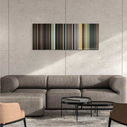 Stardust color palette canvas on a concrete wall above a gray sectional sofa