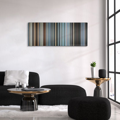 Sully color palette canvas above a black sofa with a gold-topped table