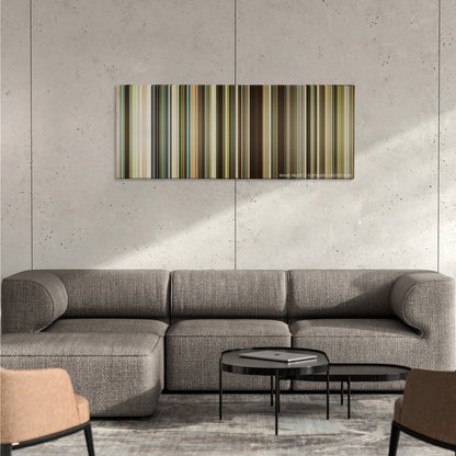 The Founder color palette canvas on a concrete wall above a gray sectional sofa