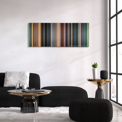 Blow color palette canvas above a black sofa with a gold-topped table