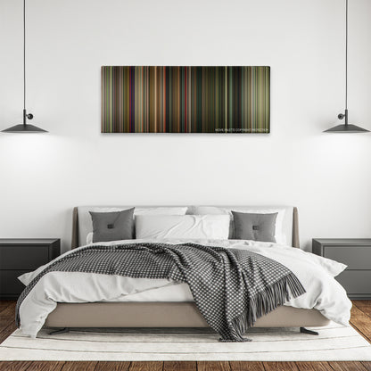 Time Lapse color palette canvas above a bed, between two black pendant lamps