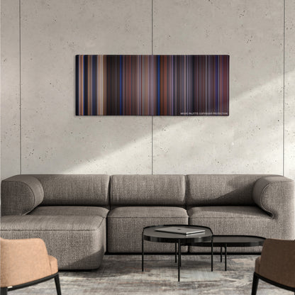 Casper color palette canvas on a concrete wall above a gray sectional sofa