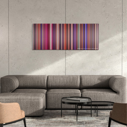 Showgirls color palette canvas on a concrete wall above a gray sectional sofa