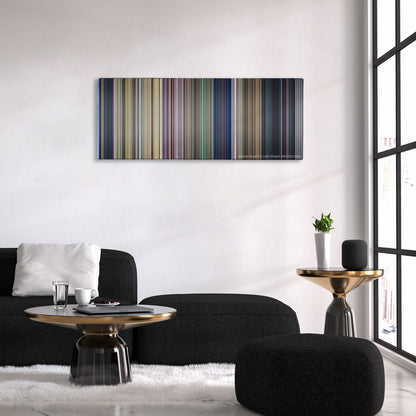 Lady and the Tramp color palette canvas above a black sofa with a gold-topped table