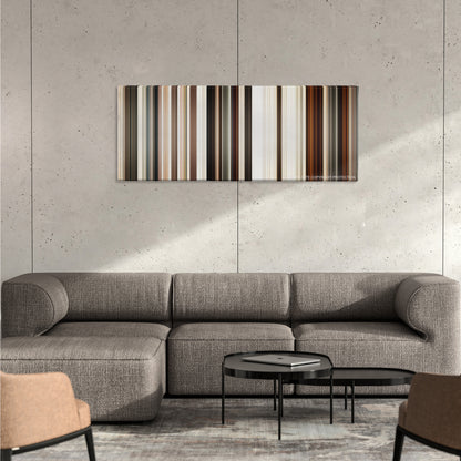 Jarhead color palette canvas on a concrete wall above a gray sectional sofa