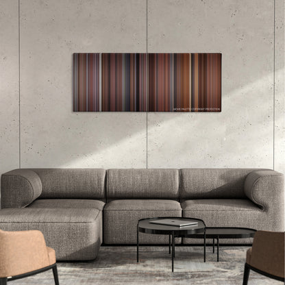 Hoosiers color palette canvas on a concrete wall above a gray sectional sofa