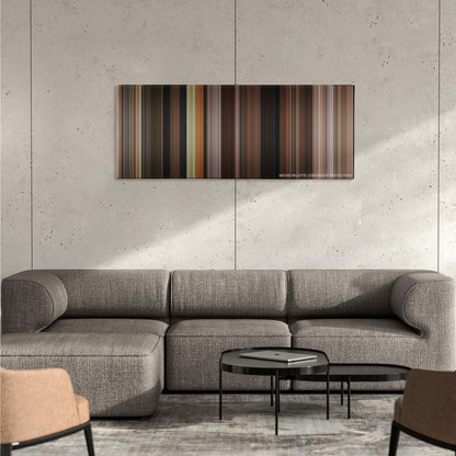 Dogma color palette canvas on a concrete wall above a gray sectional sofa