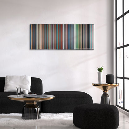 Castle in the Sky color palette canvas above a black sofa with a gold-topped table