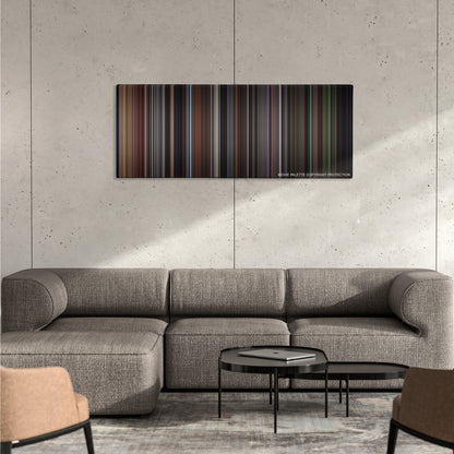 Vertigo color palette canvas on a concrete wall above a gray sectional sofa