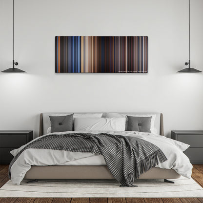 Stargate color palette canvas above a bed, between two black pendant lamps