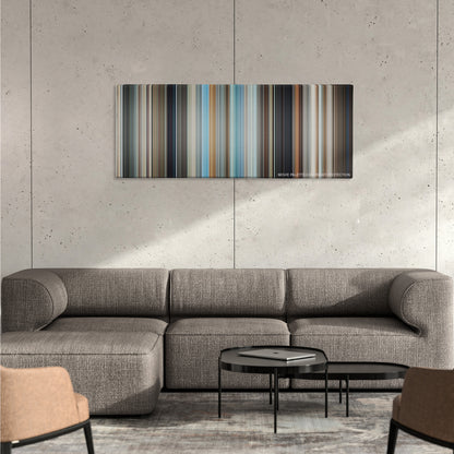 The Hangover color palette canvas on a concrete wall above a gray sectional sofa