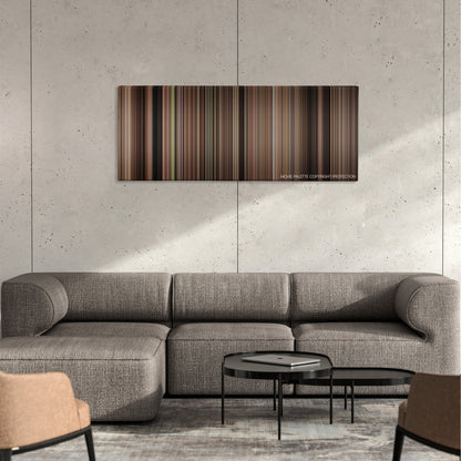 The Sting color palette canvas on a concrete wall above a gray sectional sofa