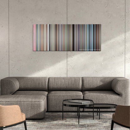 Patton color palette canvas on a concrete wall above a gray sectional sofa