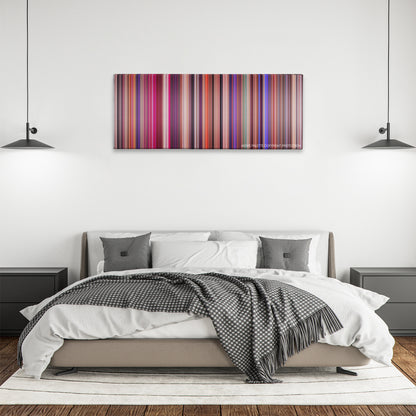 Showgirls color palette canvas above a bed, between two black pendant lamps