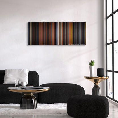 Little Women color palette canvas above a black sofa with a gold-topped table
