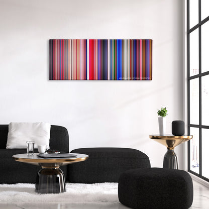 Suspiria color palette canvas above a black sofa with a gold-topped table