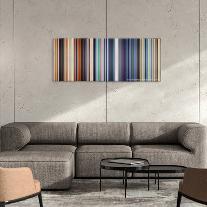 WALL*E color palette canvas on a concrete wall above a gray sectional sofa