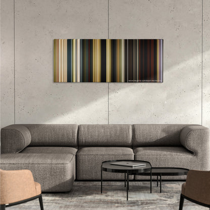 The Jungle Book color palette canvas on a concrete wall above a gray sectional sofa