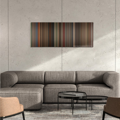 Labyrinth color palette canvas on a concrete wall above a gray sectional sofa