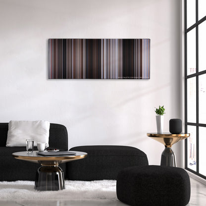 For a Few Dollars More color palette canvas above a black sofa with a gold-topped table