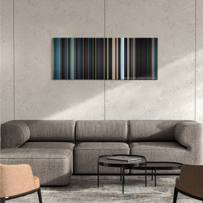 Serenity color palette canvas on a concrete wall above a gray sectional sofa