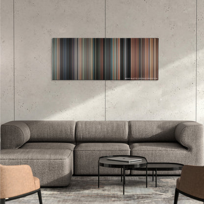 Thelma & Louise color palette canvas on a concrete wall above a gray sectional sofa