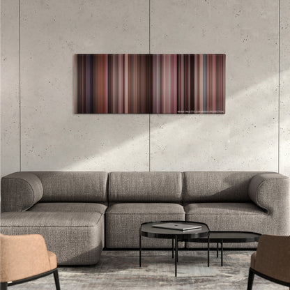 Pretty Woman color palette canvas on a concrete wall above a gray sectional sofa