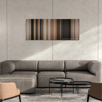 Secondhand Lions color palette canvas on a concrete wall above a gray sectional sofa