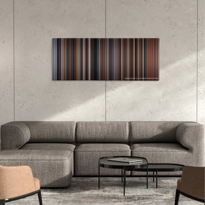 The Hurricane color palette canvas on a concrete wall above a gray sectional sofa