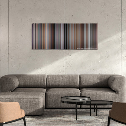 Memento color palette canvas on a concrete wall above a gray sectional sofa
