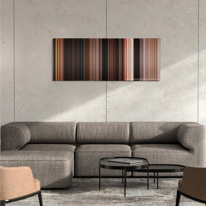 The Fast and the Furious color palette canvas on a concrete wall above a gray sectional sofa